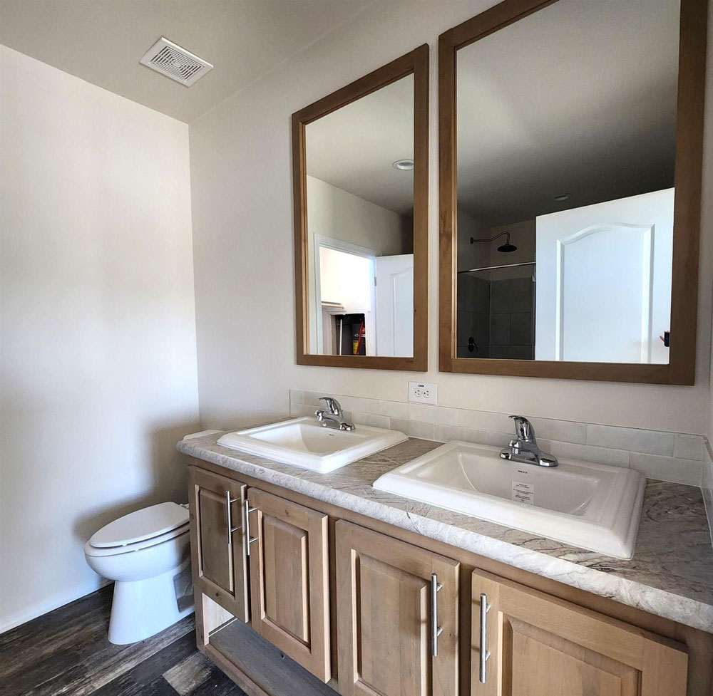 Double vanities in the luxurious primary bathroom of 28563N