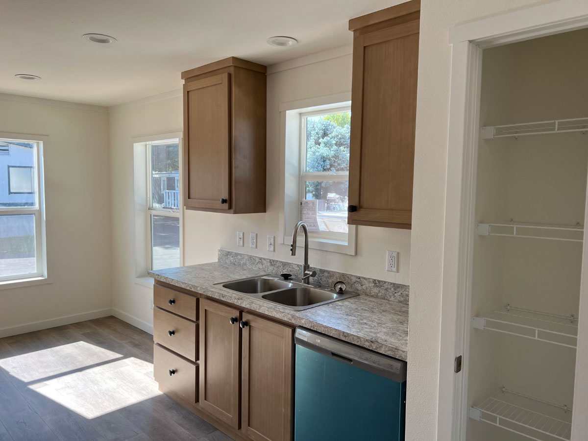 Dishwasher and stainless steel sink included in the Clayton Tempo Here Comes the Sun