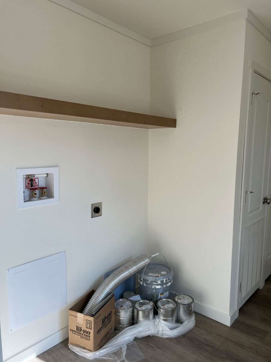 Efficient laundry room in the Tempo Here Comes the Sun manufactured home