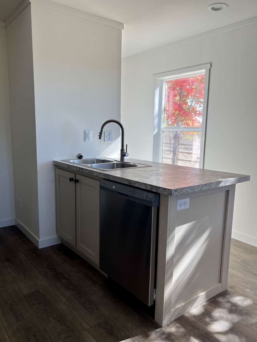 Kitchen sink with a view of beautiful trees in the Clayton Tempo Imagine