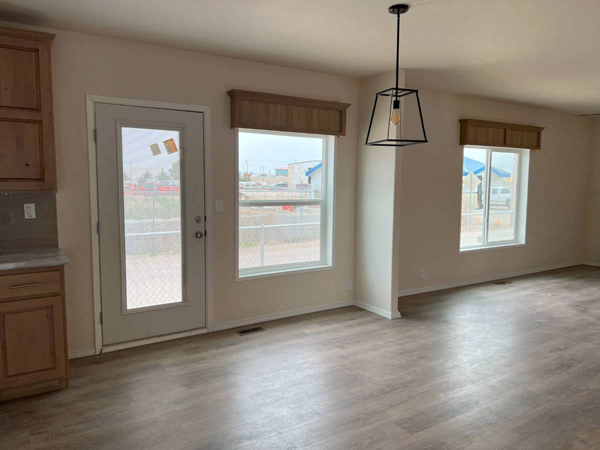 Dining room with trendy light fixture in the 28683N Fleetwood home