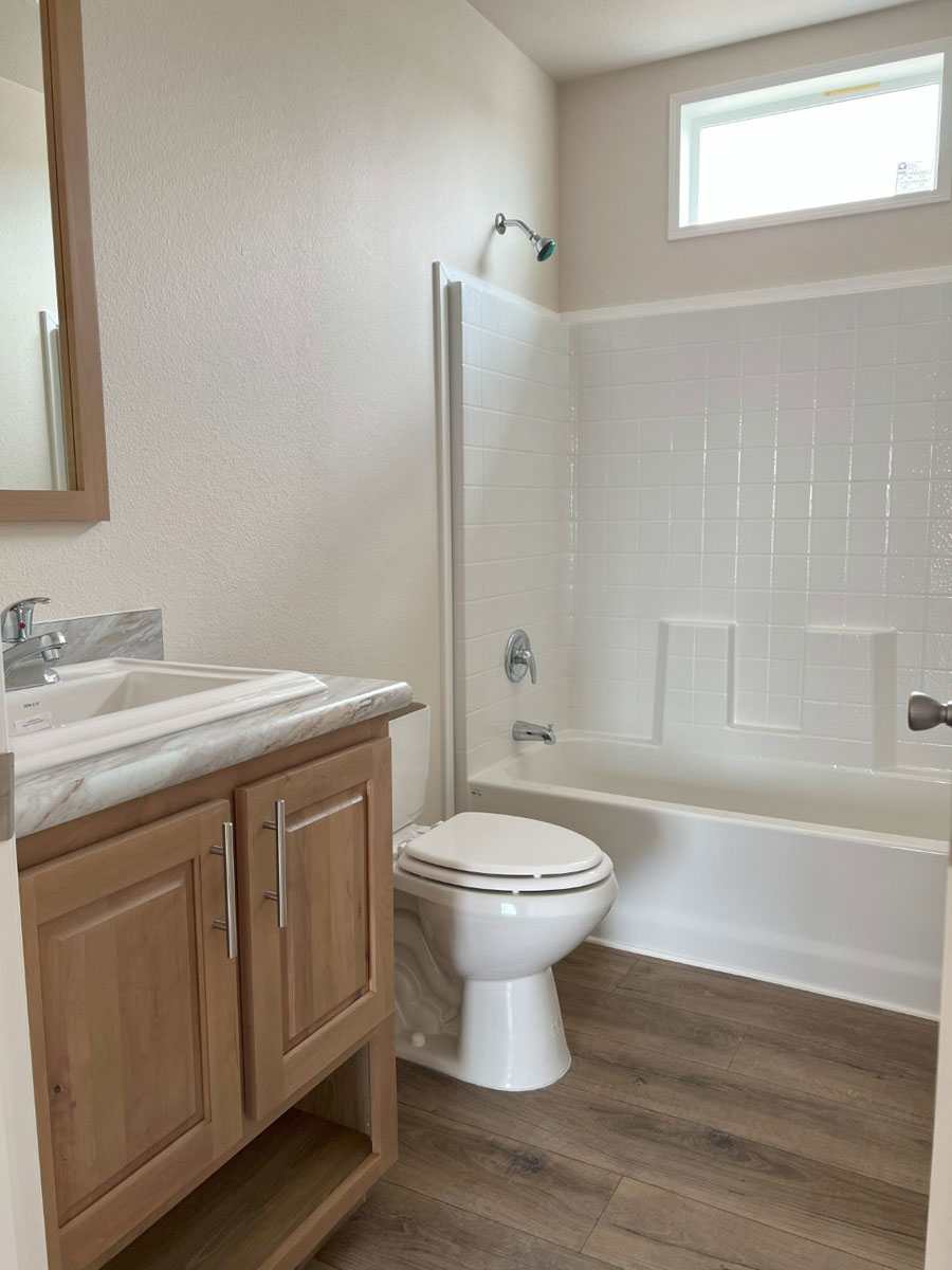 Small bath with one-piece tub/shower, perfect for families