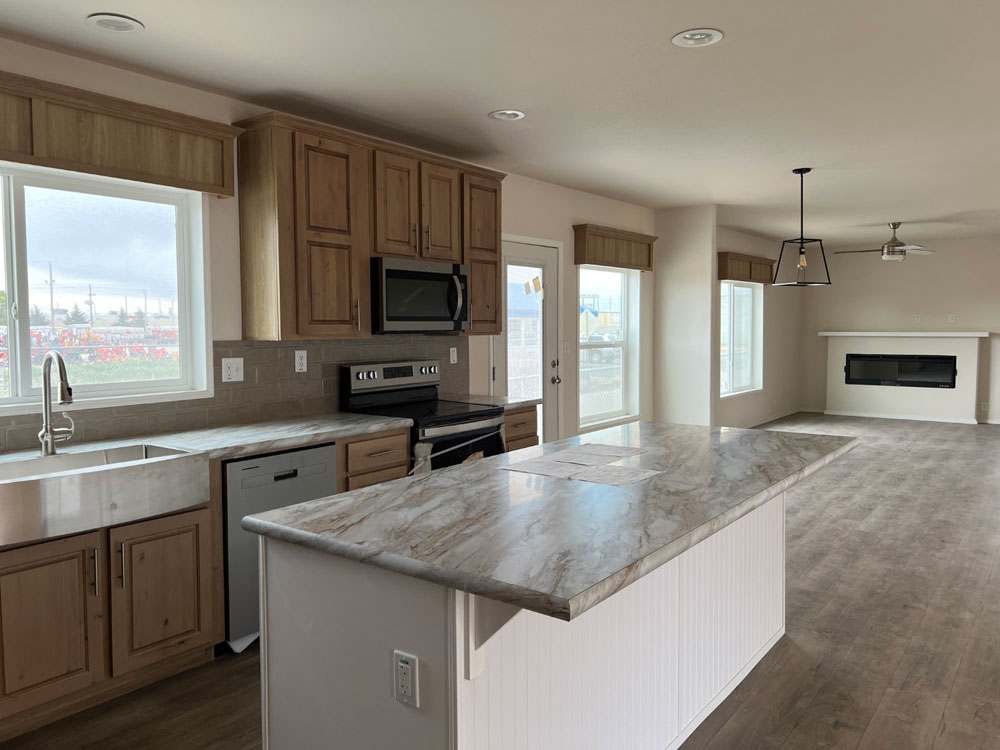 Large island flows into dining and family room in Fleetwood Bruneau