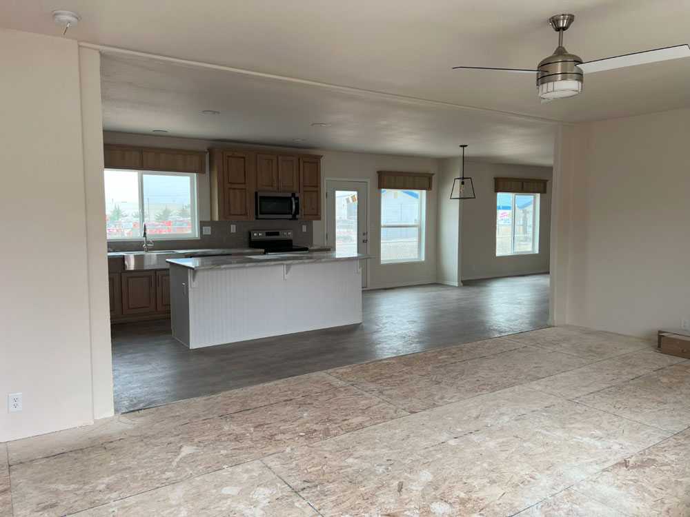 Large living area with bright windows in the Fleetwood Bruneau home