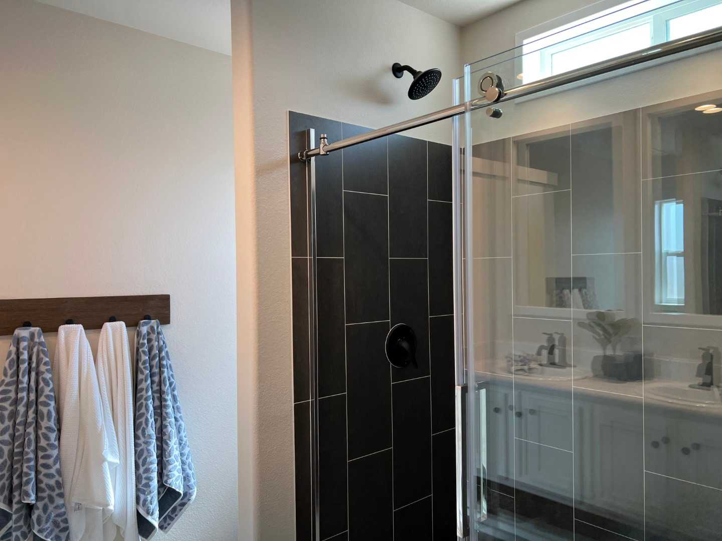 Modern fixtures throughout The Opal, including a tile shower.