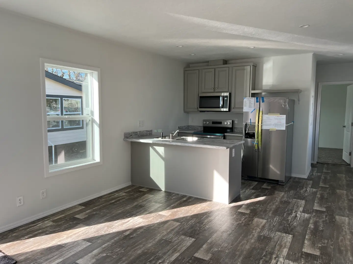 Large open concept living room in this Champion Singlewide home