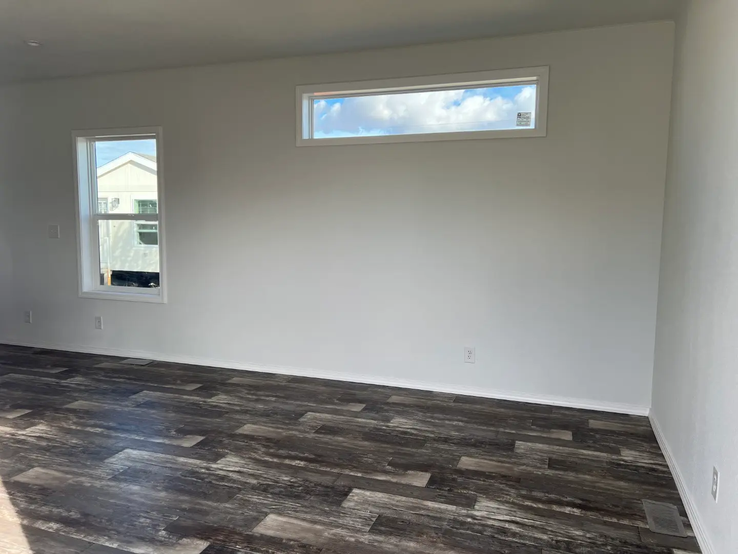 Large window in living room insures plenty of natural light in this 2 bedroom home