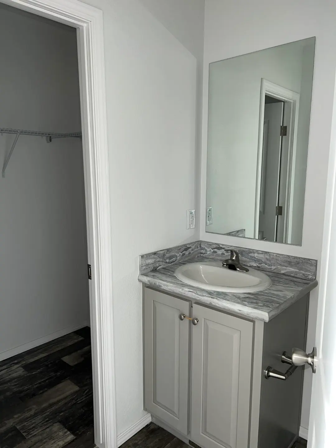 Vanity and Large walk in closet in this affordable home