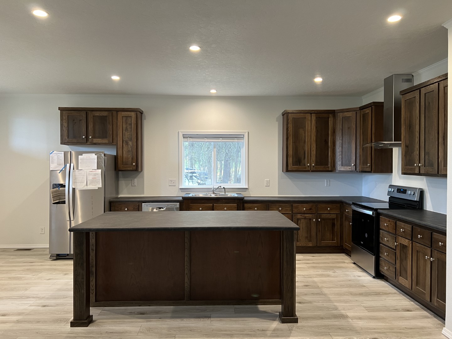 Kitchen with modern stainless steel appliances on the Champion Crystal Bay Home