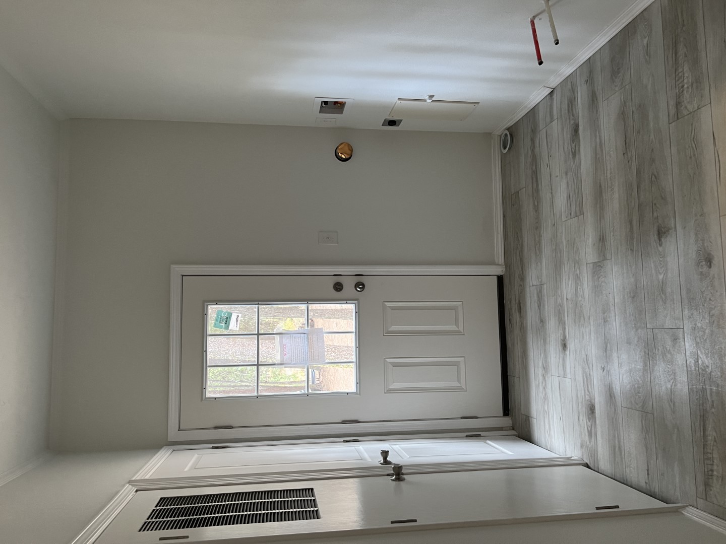 Efficient utility room with stackable washer and dryer prep.