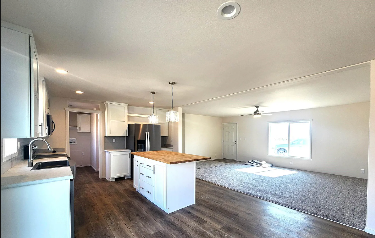 Second view of the open concept living room in Cavco Broadmore 28683B
