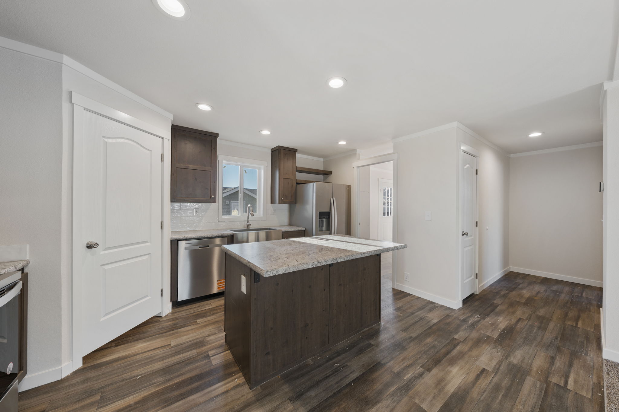 Full view of kitchen layout in Cavco Rhythm 28664R manufactured home interior